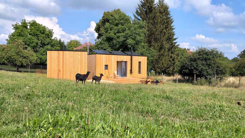 Compact prefab cabin suited to remote or off-grid living